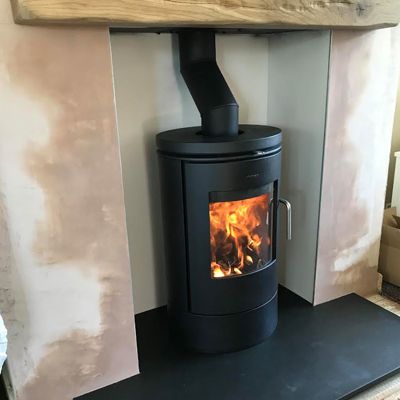 Curved freestanding stove fitted by Firebug in Bristol