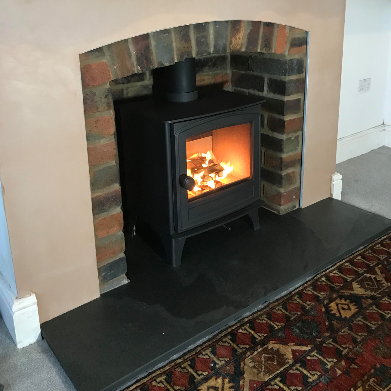Brick recess with slate hearth fitted by Firebug Bristol